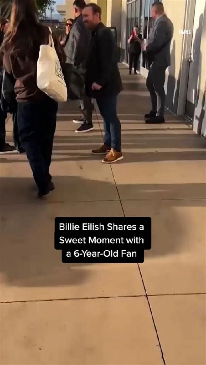 Bell shares a sweet moment with the former First Lady as they sat on court at Arthur Ashe