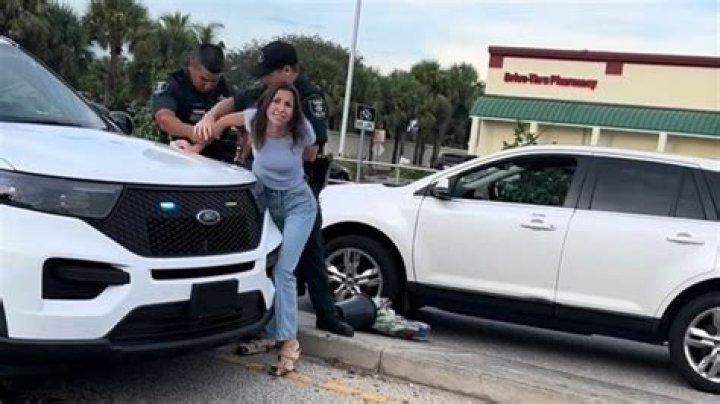 Chaotic moment Florida woman Annika Olson is handcuffed after trying to