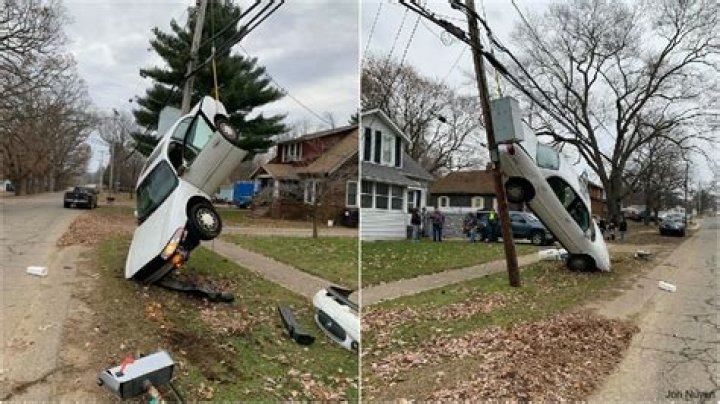 Crash leaves car suspended from utility wires in Bristol, driver facing
