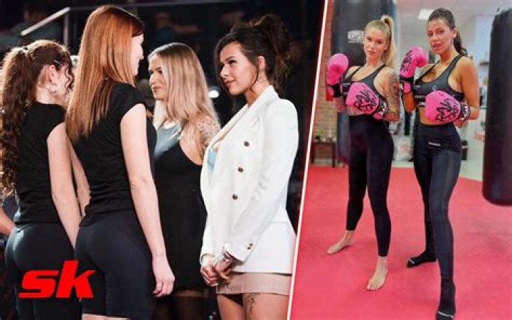 Female fighters Inked Dory and Karina Pedro flash their boobs at the