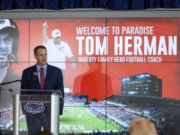 Image of Tom Herman with his wife Michelle