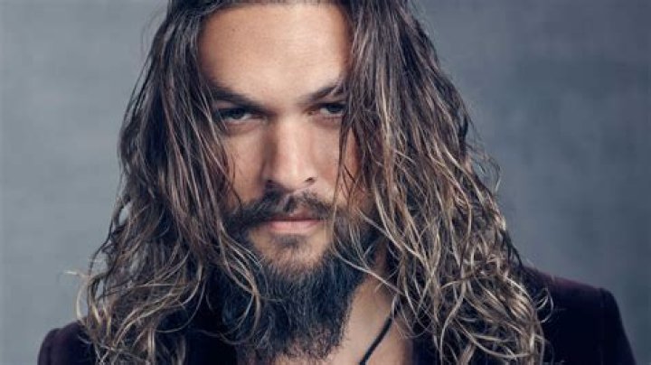Jason Momoa Can't Contain His Joy After Les Claypool Gives Him A Bass