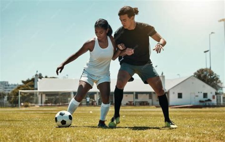 "People Playing Soccer With Human Head"
