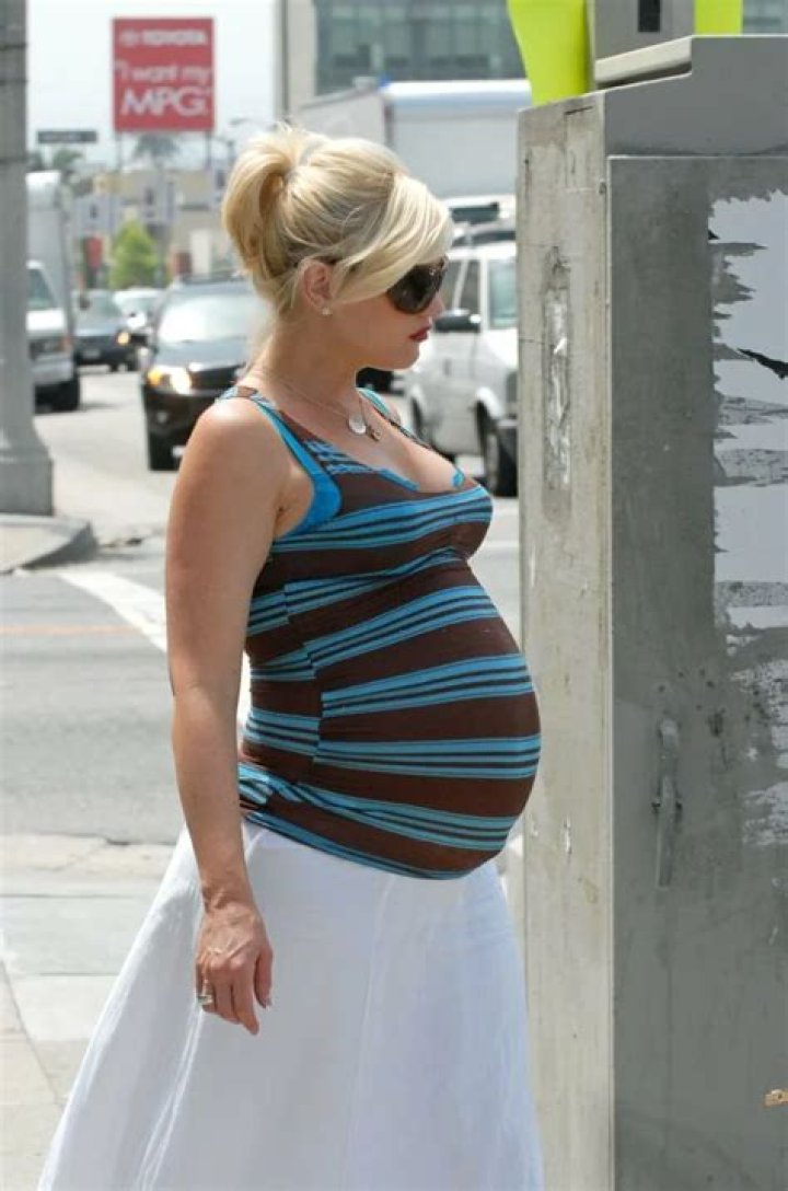 Pregnant Gwen Stefani Glows While Flaunting Baby Bump on the Way to
