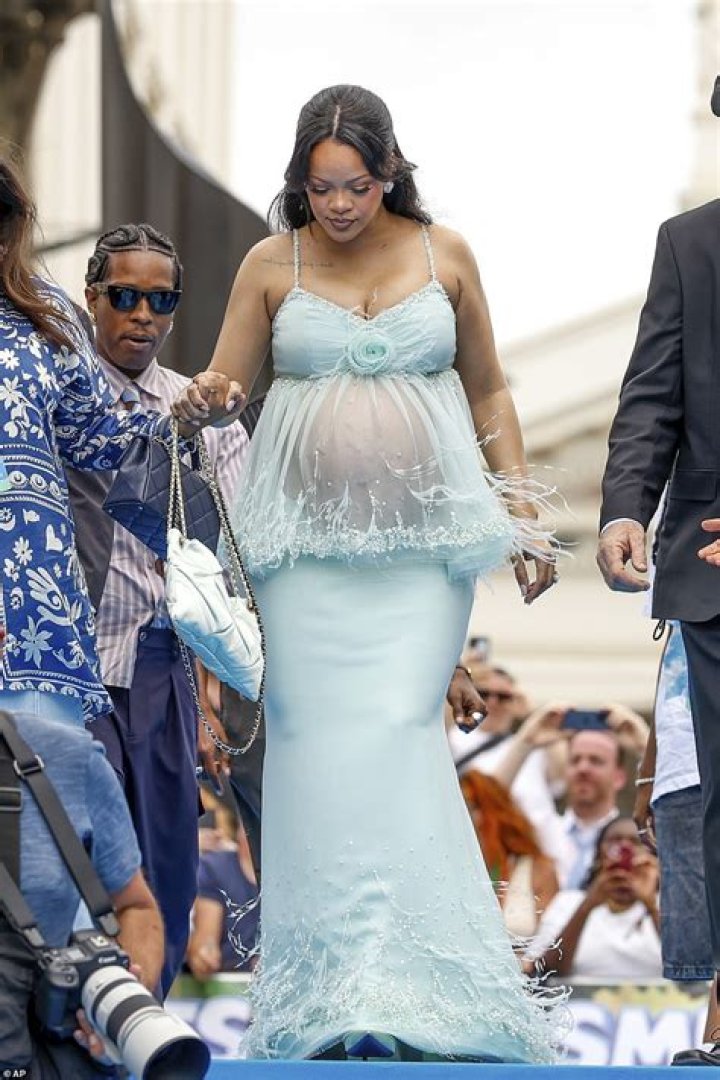 Pregnant Rihanna drapes her baby bump in designer vintage