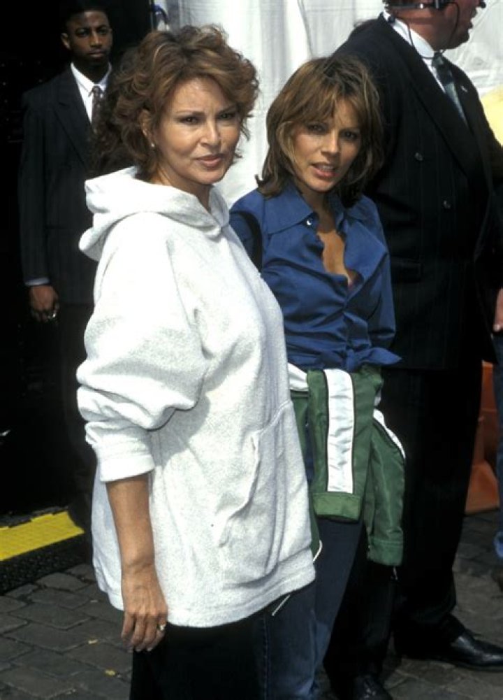 Raquel Welch holding a baby at Westmead Childrens Hospital in Sydney